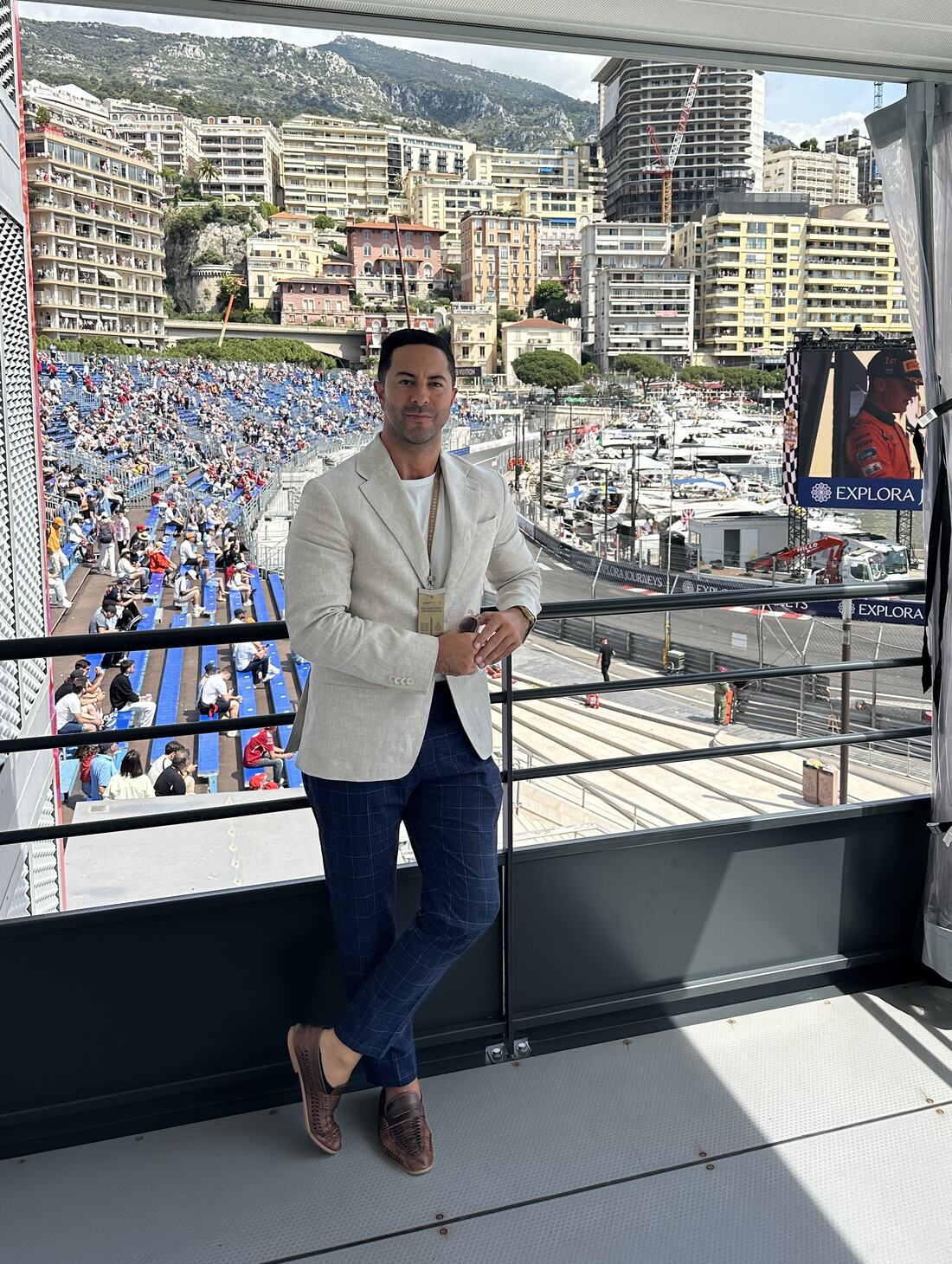Adam Agresta in a linen blazer overlooking the Monaco Grand Prix circuit