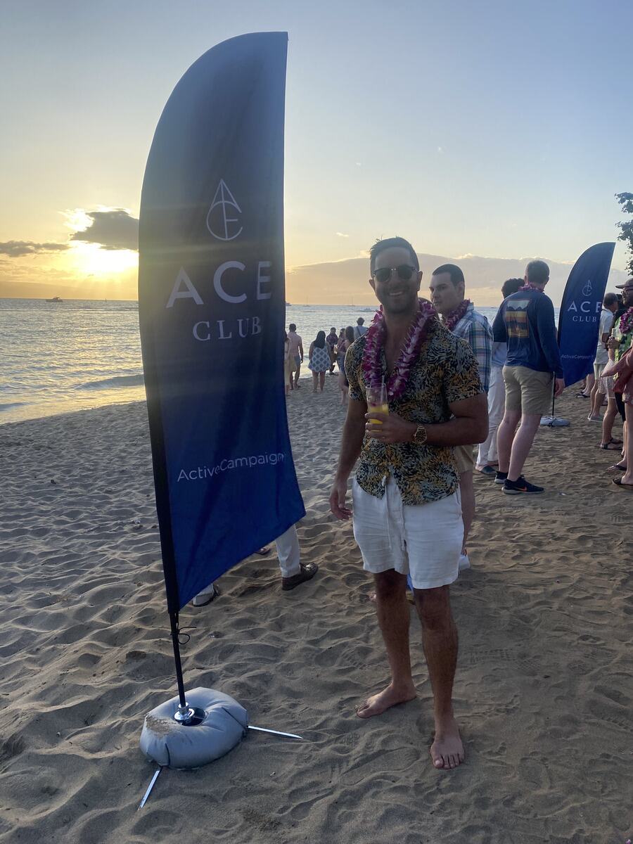 Adam at ActiveCampaign’s ACE Club on the beach at sunset