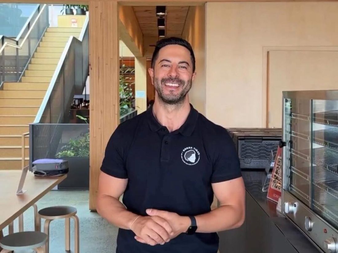 Adam Agresta in a Nonna Tina’s polo in the Nonna Tina’s kitchen